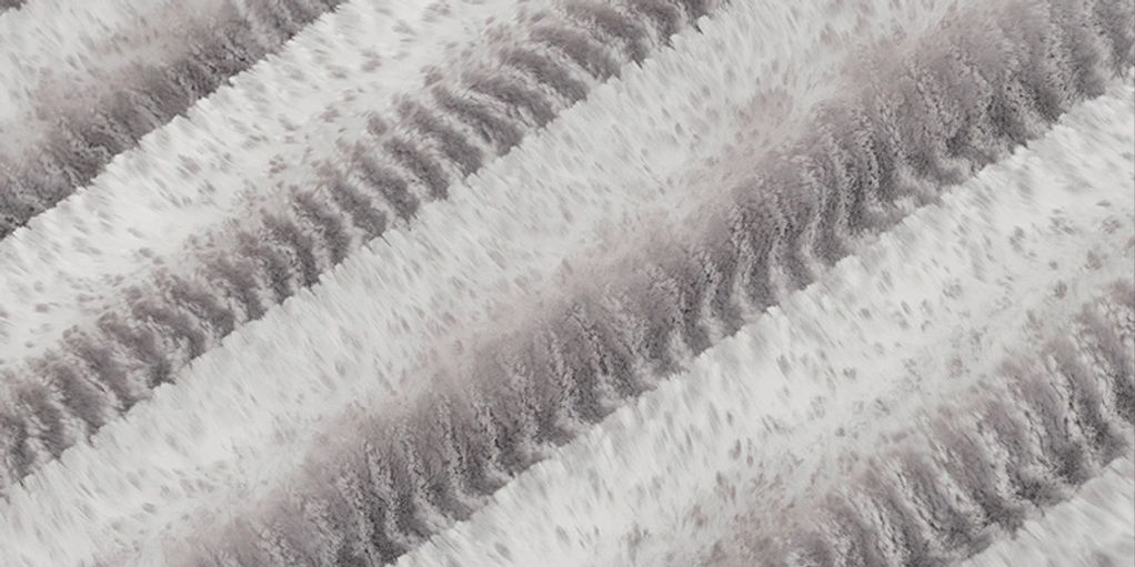 Close-up of textured furry stripes in a neutral color palette.