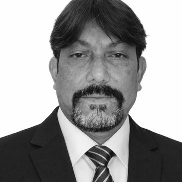 Professional man in a suit and tie with a serious expression.