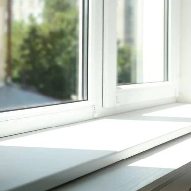 Sunlight streaming through a clean white window sill.