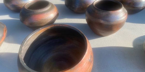 A collection of pottery on a table.