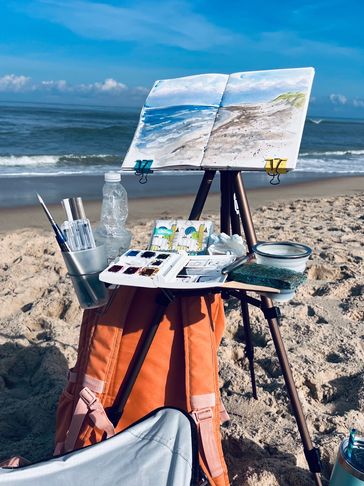 beach travel sketching watercolor plein air sand sitting backpack