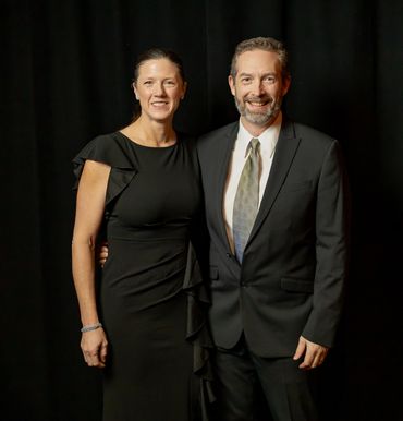 A couple standing together during a photo shoot