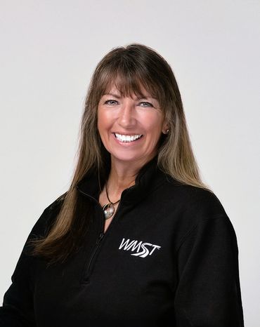 Woman smiling into camera during a headshot session in Everett, Washington.