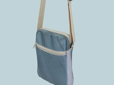Compact blue crossbody bag with beige straps and zipper compartments.