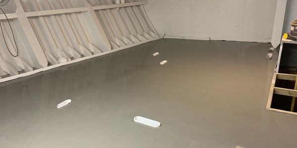 Resin flooring in the interior of a boat, installed by UP Group. 