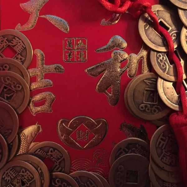 Feng shui coins and red envelope.