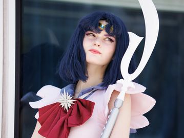 Person cosplaying as Sailor Saturn from Sailor Moon.