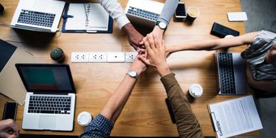 Teambuilding hands together - Unity