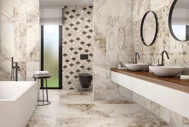 Luxurious bathroom with marble tiles, double sinks, and a glass-enclosed shower.