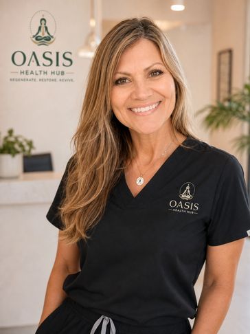 Smiling woman in black medical scrubs at Oasis Health Hub.
