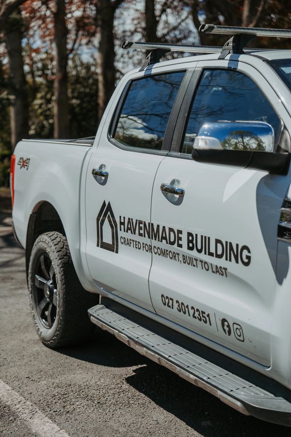 White pickup truck with Havenmade Building logo and contact details on the side.