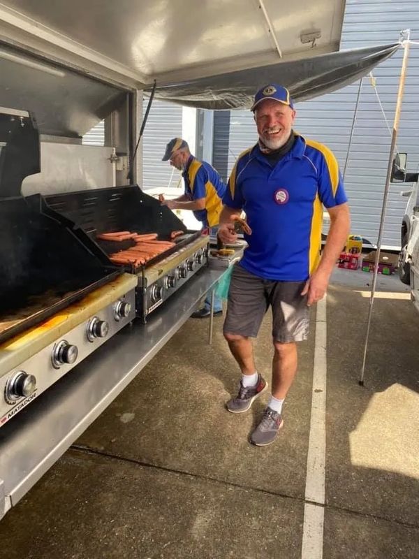 Logan Village Lions club volunteers working at sausage sizzle.