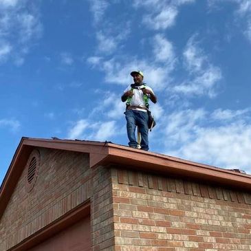 Roofer installing a roof  