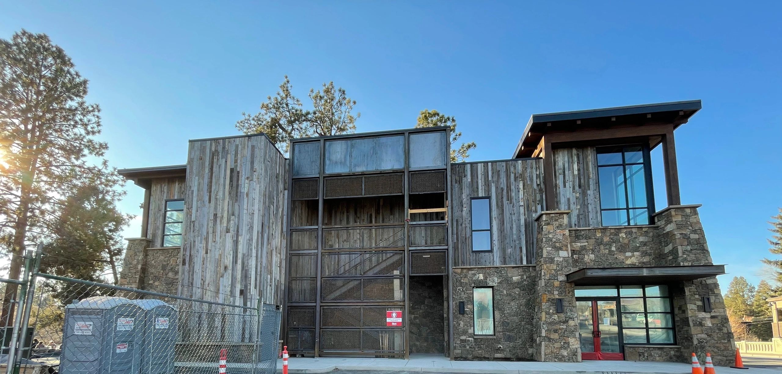 Reclaimed barnwood and stone siding on a downtown Bend, Oregon commercial building installed by Elite Construction Contracting