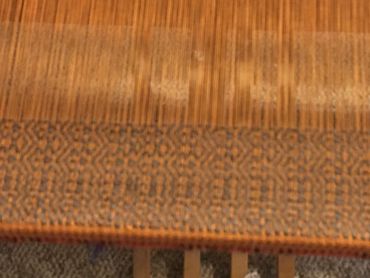 Orange brûlée cotolin warp with hand-dyed Painted Hand Farm wool. Iron mordant with black walnut (ak