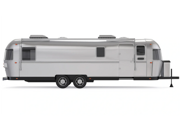 Sleek silver travel trailer with dual axles and minimalist design.