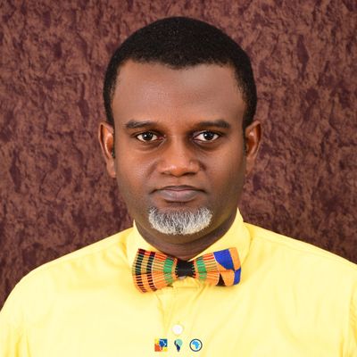 Kenneth Igiri in a Ghanaian bow tie looking straight at the camera