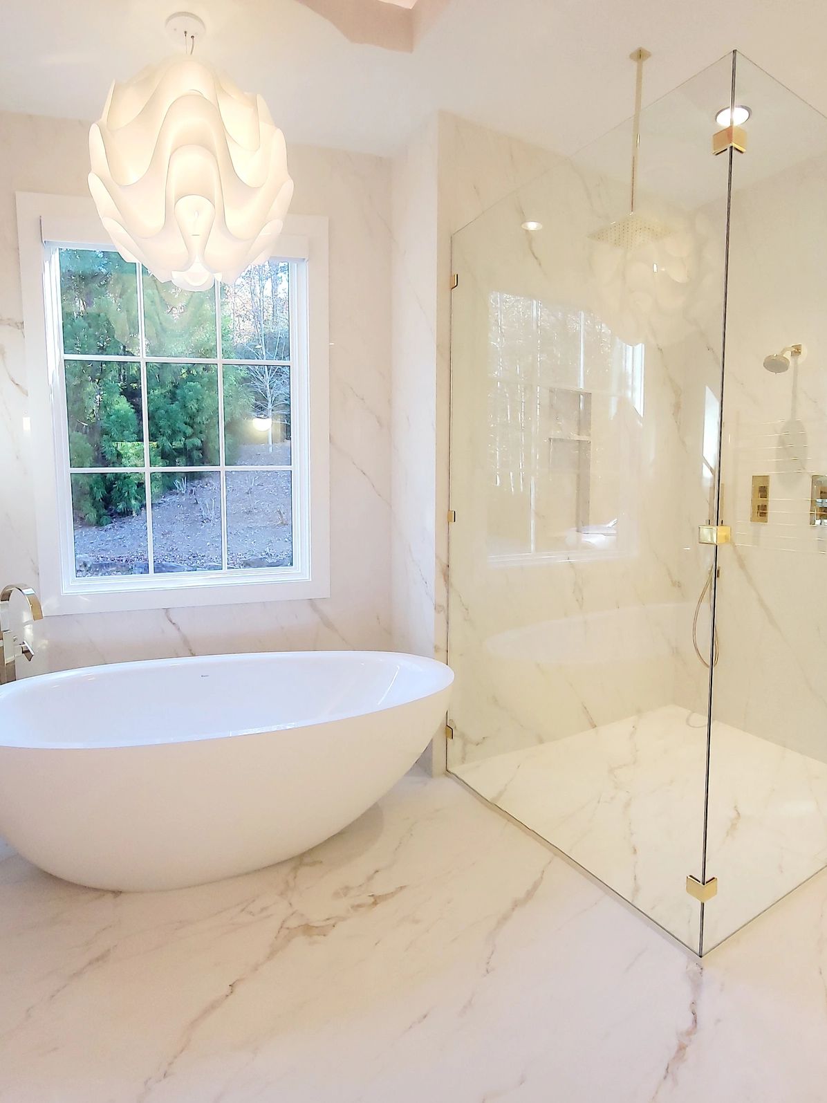 Bathroom with a tub and a shower