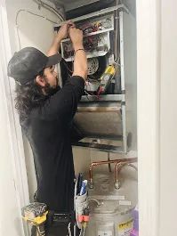 St Louis HVAC Technician Working On Furnace Repair and Heater