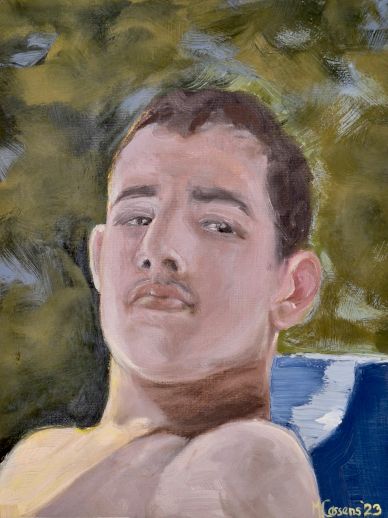 Portrait of a young man with a mustache, looking confidently.