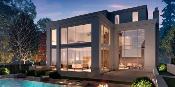 Smart lighting automation and motorized shades in a modern home, controlled by a touchscreen panel.