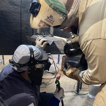 Welding Instructor at SWA, Houston, TX showing student the proper technique