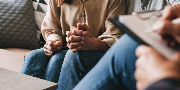 Couples in couples therapy with a counselor