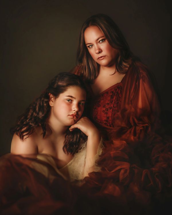 mom and daughter in fine art gowns
