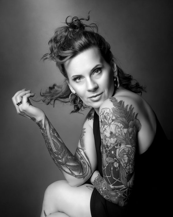 black and white portrait of a tattooed woman