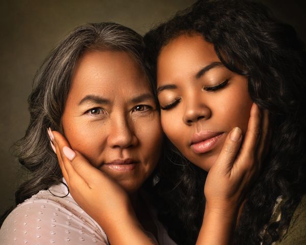 Close up portrait on mother and daughter