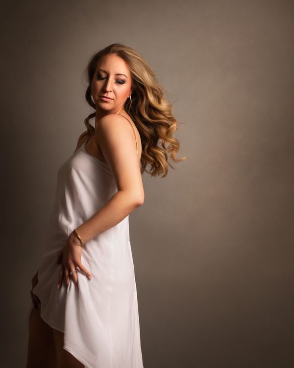 half length image of a woman in a flowing white dress