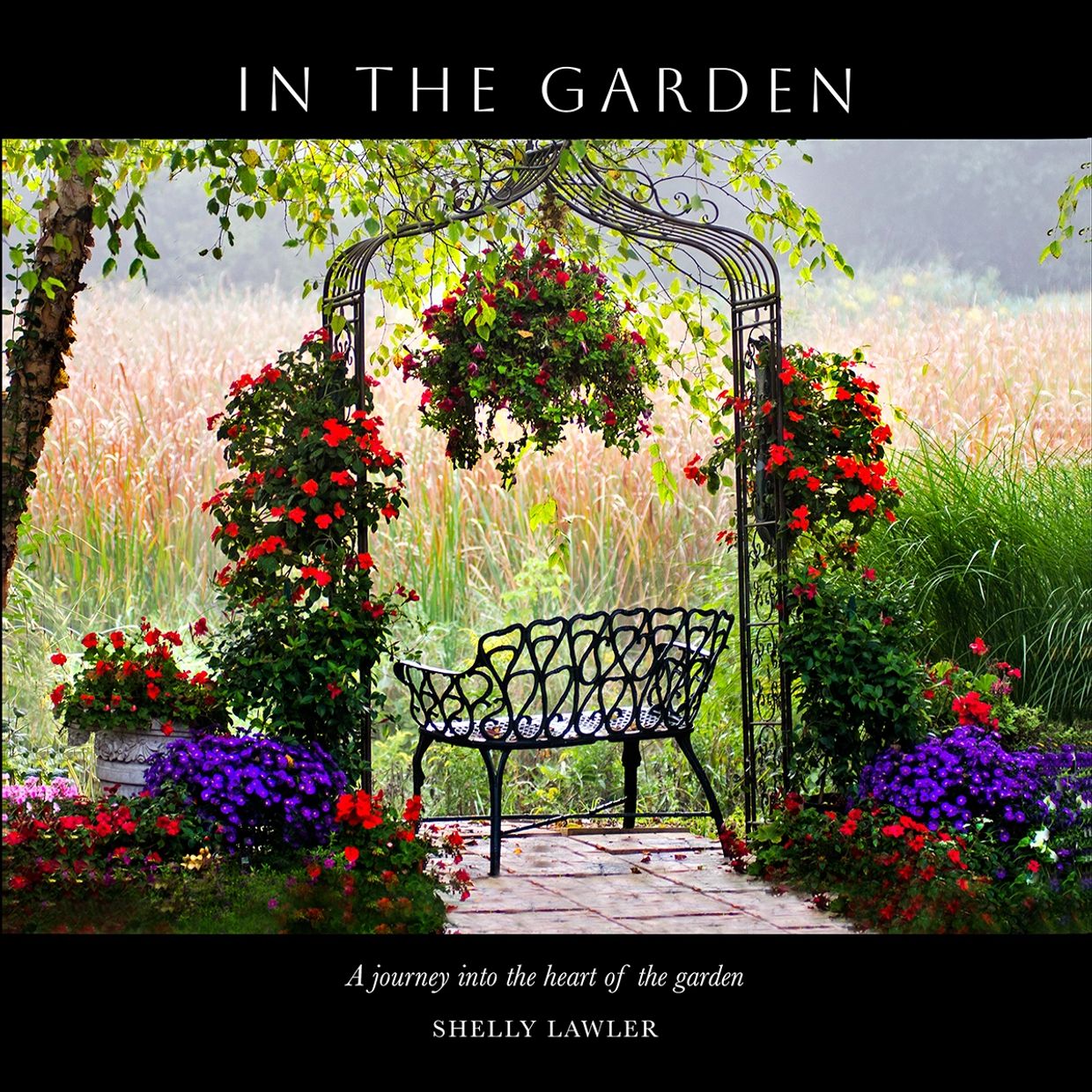 A serene garden bench surrounded by colorful flowers under a decorative arch.