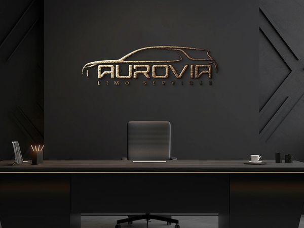 Sleek office reception with gold Aurovia Limo Services logo on dark wall.