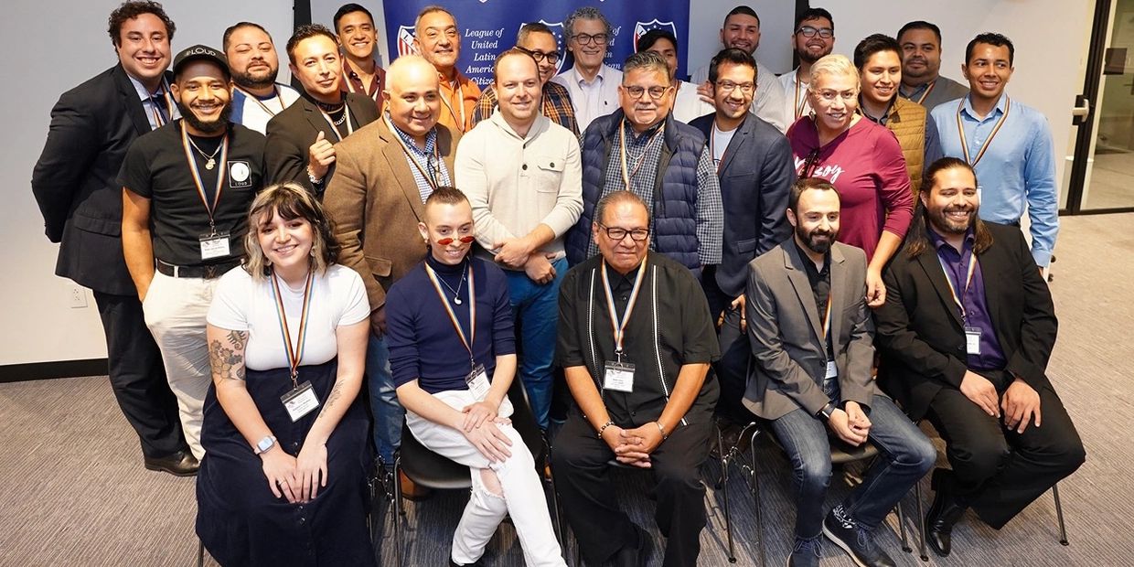 Group photo of diverse professionals at a conference.