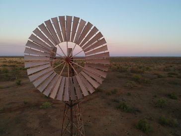 Old windmill in a dry landscape.