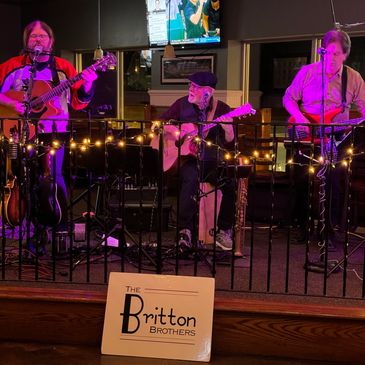 Britton Brothers Trio with purple lighting. 