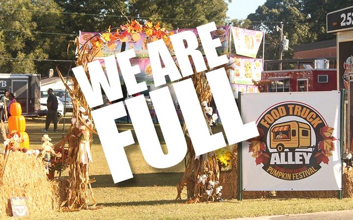Sign at Food Truck Alley Pumpkin Festival reads 'We Are Full'.