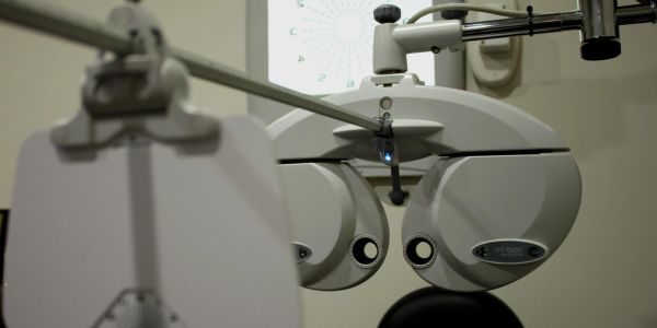 Close-up of an eye exam device in an optometrist's office.