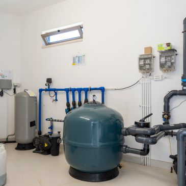Industrial water filtration and pumping system in a clean room.