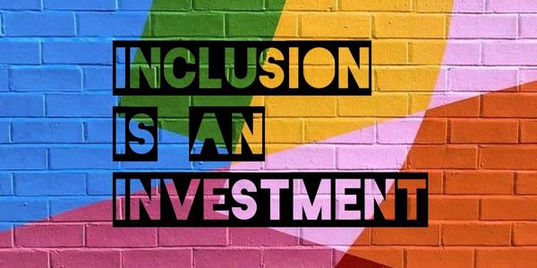 Cut out letters on a brick background painted in many bright colors says: Inclusion is an investment