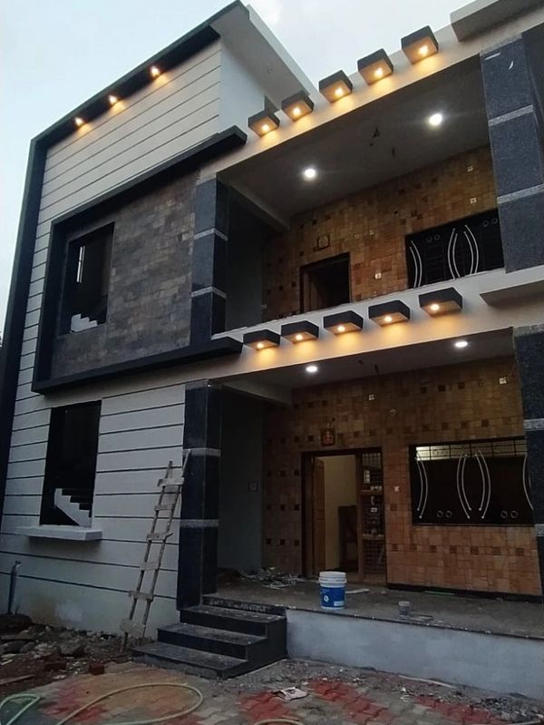 Modern exterior lighting work featuring warm LED accent lights along the façade, balcony edges, and 