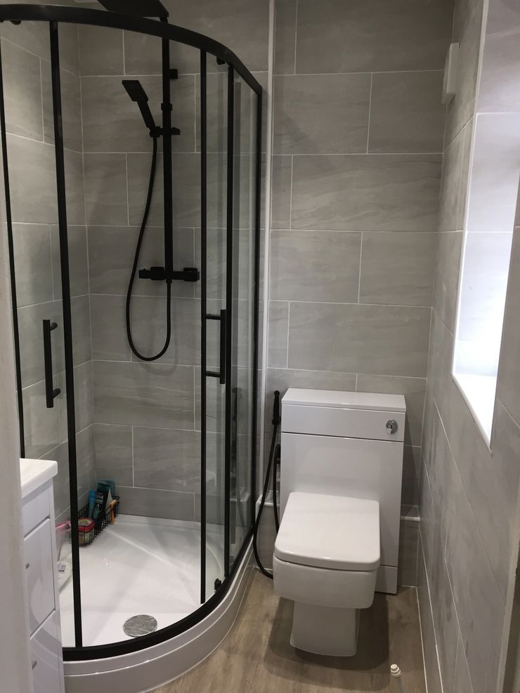 Fully tiled bathroom with new bath and shower fitted in Greater Manchester