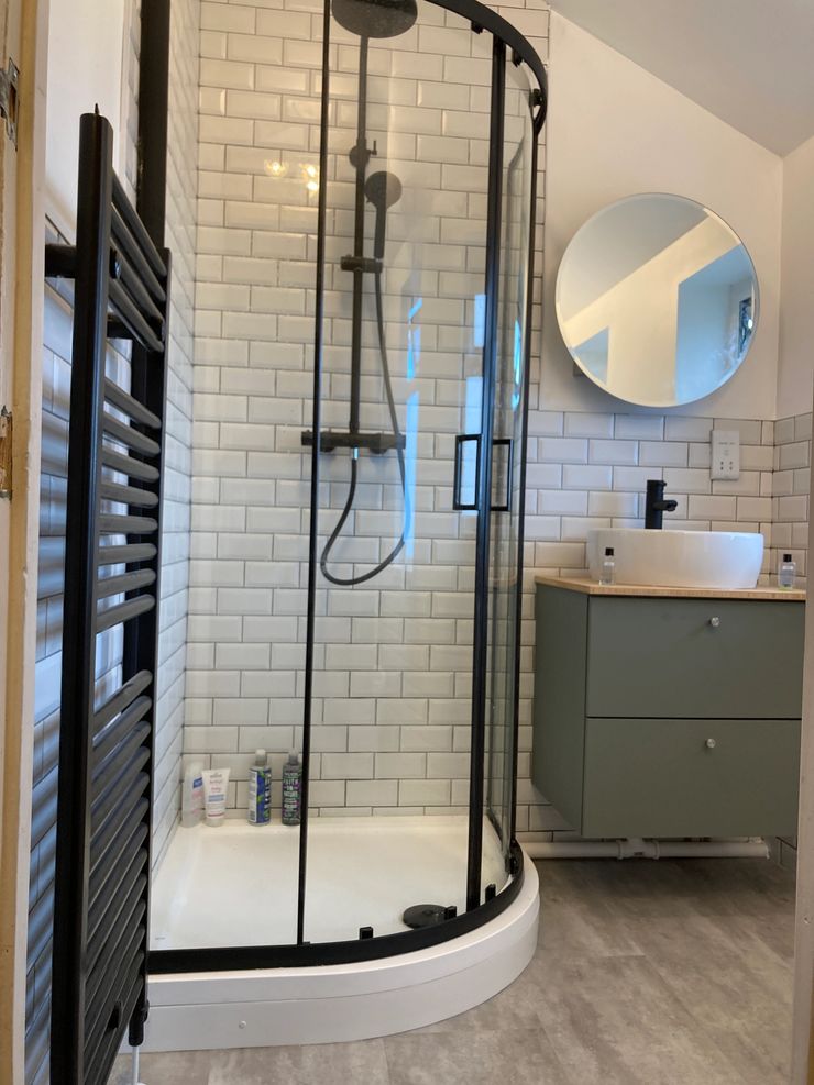 White metro tiles with black grout bathroom renovation in Manchester