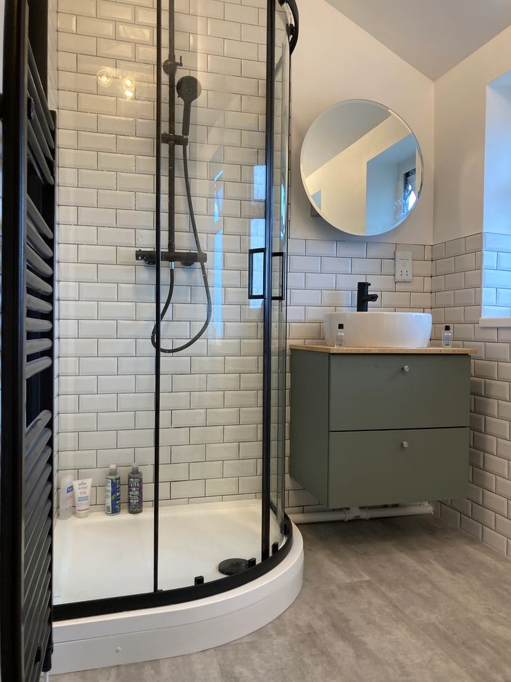 Fully tiled bathroom with metro tiles installed by bathroom fitters in Bolton