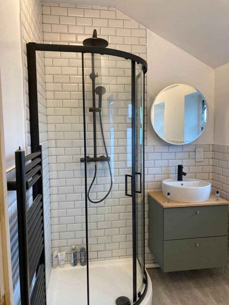Black frame shower enclosure with metro tile walls in Manchester bathroom
