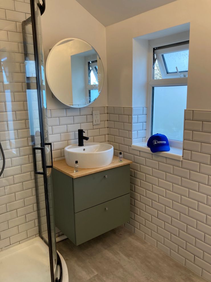 Metro tile bathroom with black grout fitted in Bolton by IK Master Build Ltd