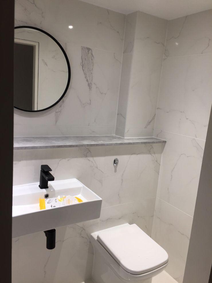 Bathroom renovation with new shower enclosure and tiling in Bolton