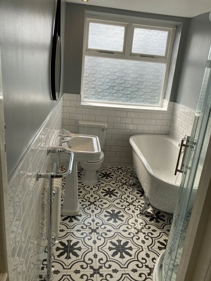 Completed Victorian bathroom with traditional toilet and basin in Greater Manchester