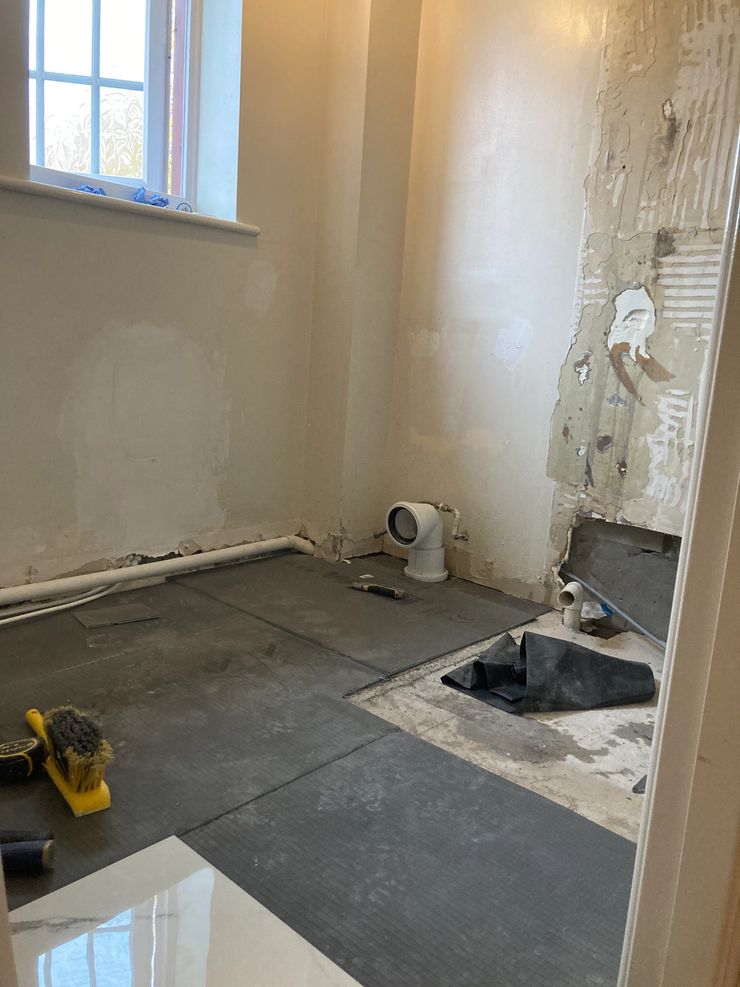 Bathroom renovation with large tiles and frameless shower in Bolton