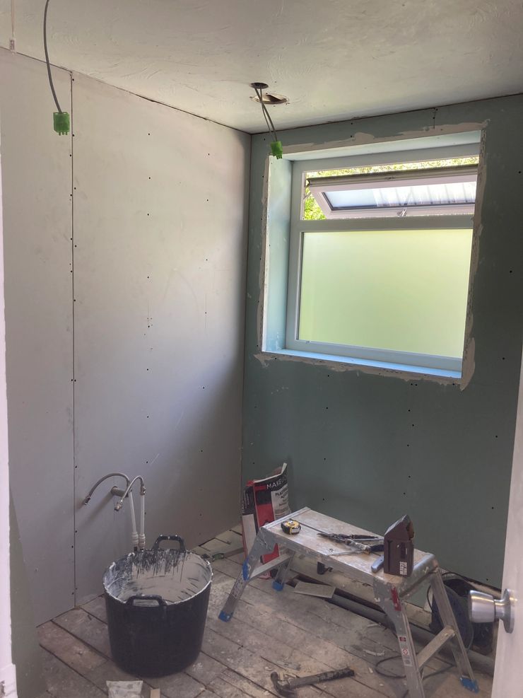 Modern bathroom design with walk-in shower and vanity unit in Manchester